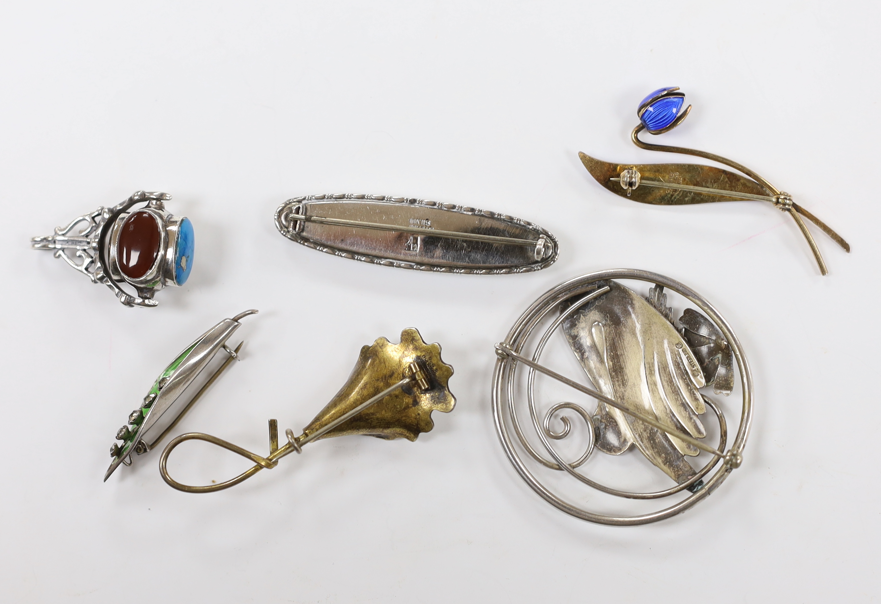 Two Norwegian sterling and enamel foliate spray brooches, largest 60mm, two sterling brooches including circular swan brooch, a modern silver, paste and enamel set leaf brooch and a modern silver and gem set spinning fob